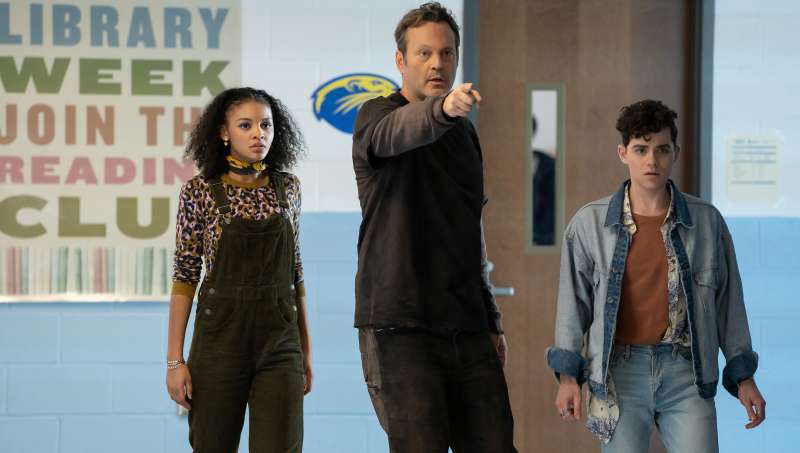 Millie in The Butcher's body (Vince Vaughn) pointing at something, with her friends Nyla (Celeste O'Connor) and Josh (Misha Osherovich). 