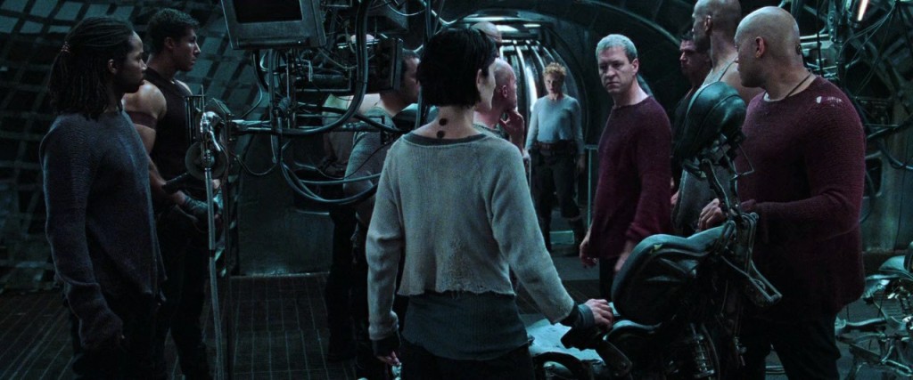 Trinity (Carrie-Anne Moss) and Morpheus (Laurence Fishburne) in a tense discussion aboard one of the ships.
