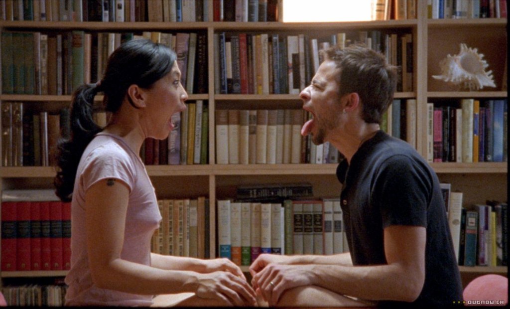Sofia (Sook-Yin Lee) and Rob (Raphael Barker) facing each other in a therapeutic confrontation. 