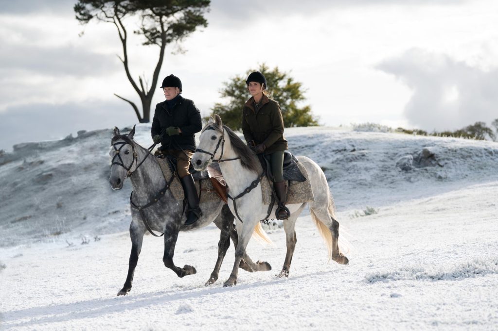 Myles (Cary Elwes) and Sophie) riding out in the snow.