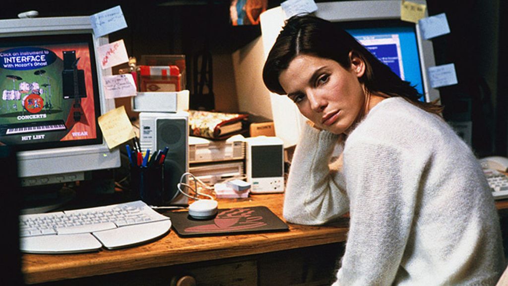 Angela (Sandra Bullock) in front of her workstation.