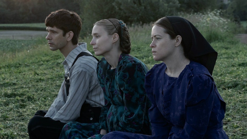 August (Ben Whishaw), Ona (Rooney Mara) and Salome (Claire Foy) looking into the distance.